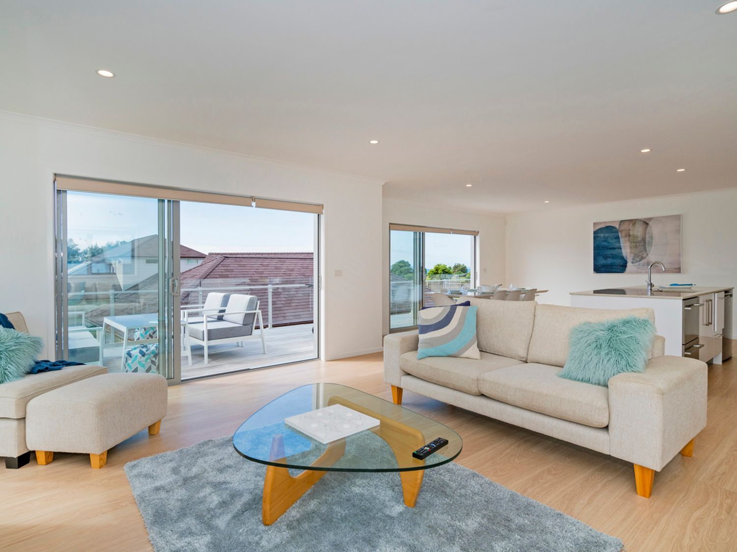 Modern open-plan living room at Coastal Pearl luxury holiday home in Matarangi